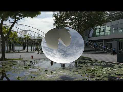 Singapore: Sky Mirror by Anish Kapoor, in front Marina Bay Sands' ArtScience Museum