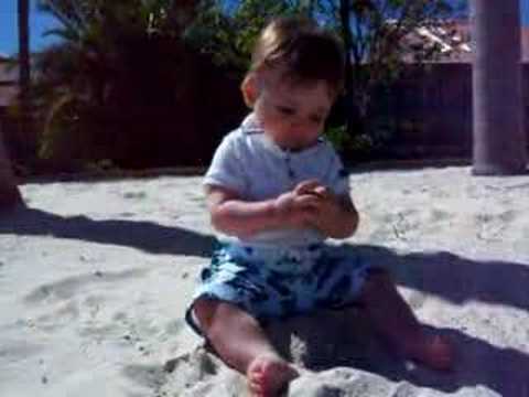 Declan playing in the beach sand