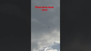 Plane flying under black cloud #shorts #plane #clouds