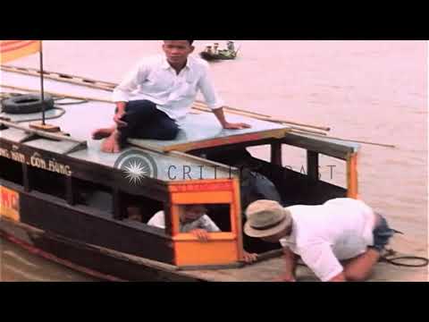 17/09/67 PBR crewmen checks ID card and papers of the Vietnamese in Mekong Delta,Republic of Vietnam