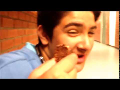 the same arab holding a piece of cake but a cancerous song