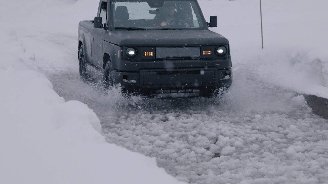 Slate Auto electric pickup being driven through a frozen slush trough during cold weather testing at Keweenaw Research Center in Michigan