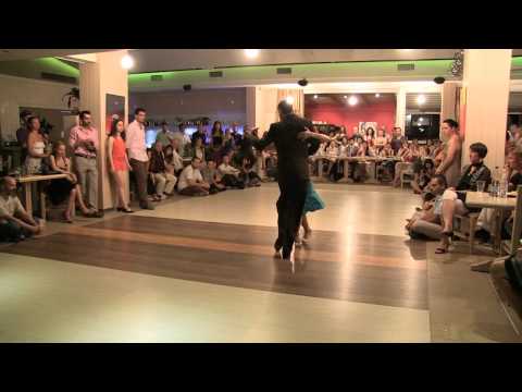  Gabriel Marino  and  Elli Karadimou  are  dancing  to  the  vals  "  Dejame Amarte Aunque Sea Un Dia  "  by  Rodolfo Biagi  at  Sunny Tango Festival  in  2012