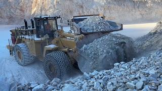 Caterpillar 992K Wheel Loader Loading Blasted Rocks Onto CAT 777F Dumpers At Aggregate Quarry