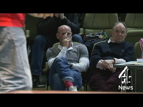 Gareth Thomas watches - reenacted on stage - the moment he tells his wife he's gay