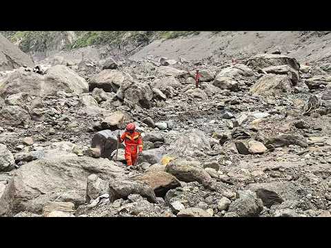 Live: Rescuers carry out search and rescue operations at mudslide-hit area on China-Nepal border