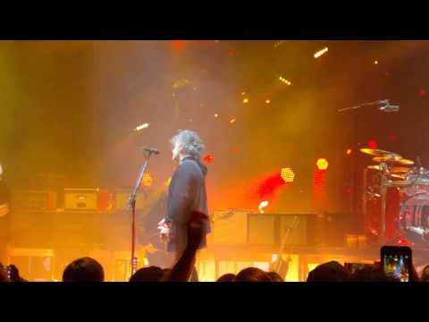 The Cure Robert Smith throws guitar