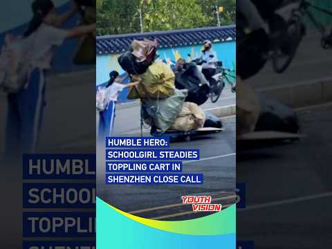 Humble hero: Schoolgirl steadies toppling cart in Shenzhen close call