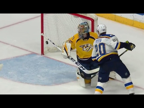 Steen redirects in the Blues' first goal with his glove
