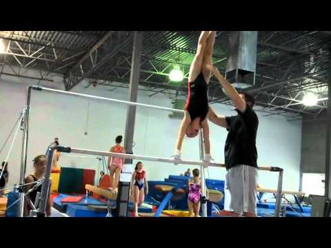 Sage, 8, bars and beam practice