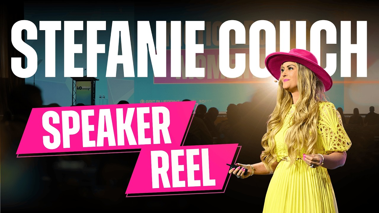 Stefanie Couch delivering a keynote on stage in her signature pink hat