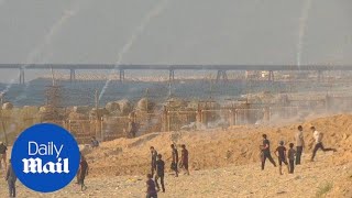 Palestinians face Israeli tear gas as they sail from Gaza