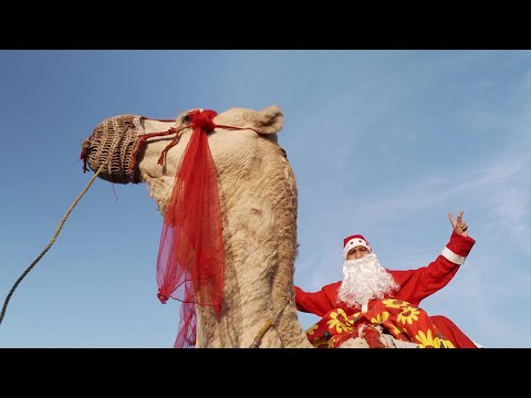 Video | Santas ski, race and ride camels as Christmas nears | AFP