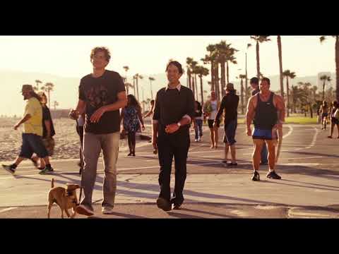 Trailer montage: open-house hustle and LA freeway shots matched to quick indie-rock edits