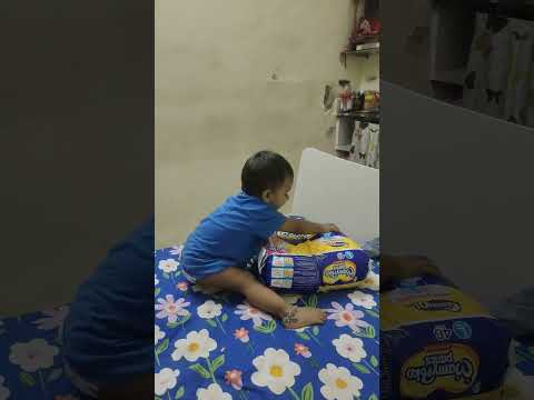 Vihaan Sharma  playing with diapers 