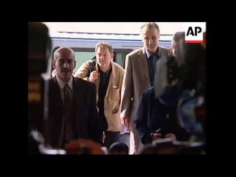 Aubenas guide and fellow hostage arrives in France, comments