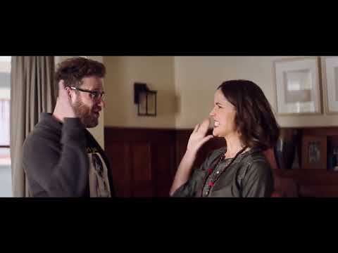 Neighbors 2 Sorority Rising official trailer frame featuring the Radners and the sorority house