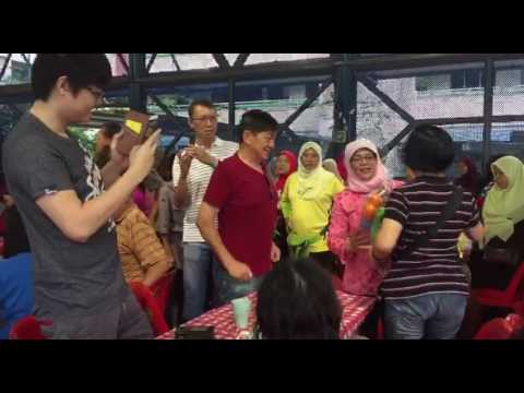 MP Madam Halimah Yacob giving out balloon flower bouquets at NS50 event