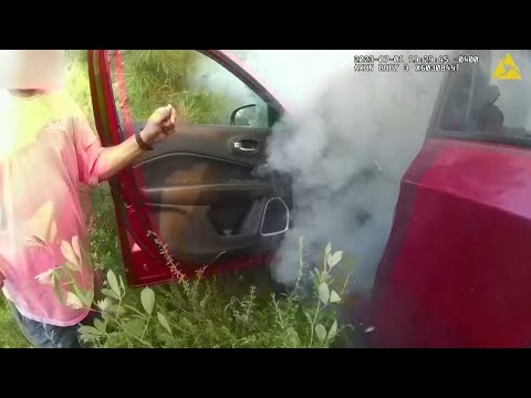 MOMENT: Woman pulled from burning vehicle in U.S. state of Georgia