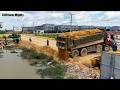 Heavy machinery, Processing Filling Up The Land, Bulldozer KOMATSU D31p, Dump Truck unloading