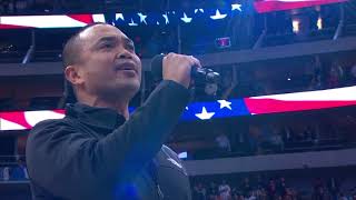 Jose Llana of The King and I sings the national anthem at a Dallas Mavericks home game