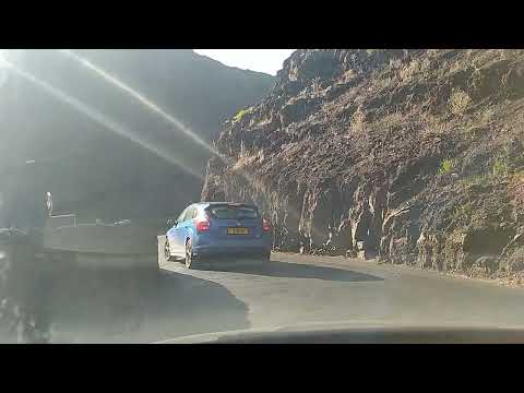Tourist driving down Ladder Hill Rd Saint Helena Island