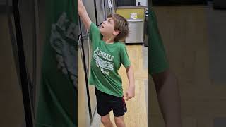 Smiling kid LOVES refrigerators!