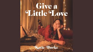 Kadr z teledysku Give a Little Love tekst piosenki Katie Burke