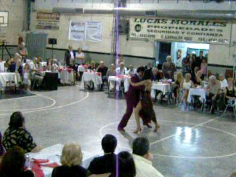  Fabian Peralta  and  Natacha Poberaj  are  dancing  to  the  tango  "  Tu Corazon  "