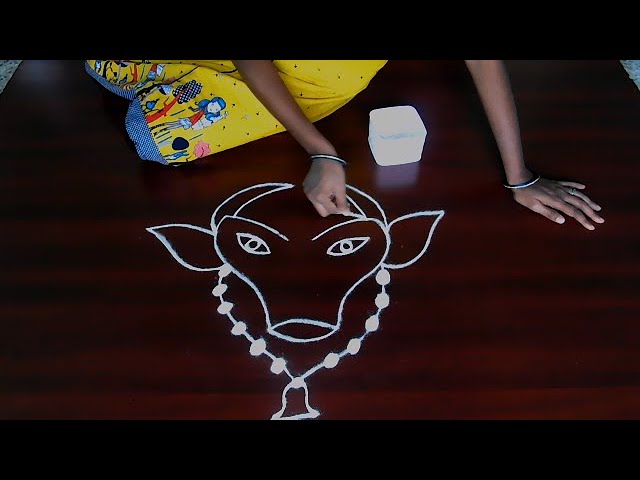 Simple rangoli design cow face for pongal by porkodi