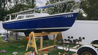 Lifting a boat off a trailer and stripping bottom paint