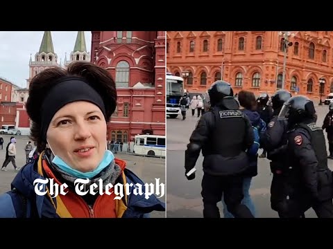 Police arrest Russian peace protester within seconds of starting interview