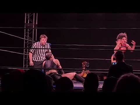 La Rosa Negra withstands two sets of rapid kicks then hits a fireman's carry takeover on Janai Kai