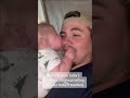 TEETHING BABY BITING INTO DAD'S FACE