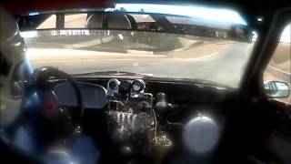 Julie driving the Ghetto Motorsports RX7 at Barber LeMons, 2014