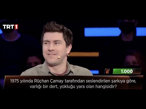 Rüçhan Çamay tarafından seslendirilen şarkıya göre, varlığı bir dert, yokluğu yara olan hangisidir?