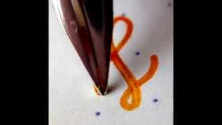 Rotring 600 fountain pen macro writing sample with Sailor Apricot ink on RHODIA dot pad