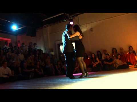  David Alejandro Palo  and  Milena Plebs  are  dancing  to  a  tango
