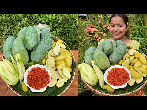 Eating yummy picked mango Vs spicy chili salt