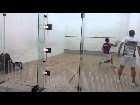 Marwan Elshorbagy training with coach Ashraf Yassin using the squash cannon ball machine.