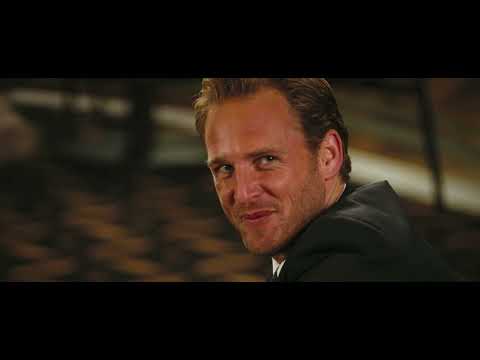 Poseidon (2006) trailer frame — the rogue wave rises as passengers celebrate New Year’s Eve