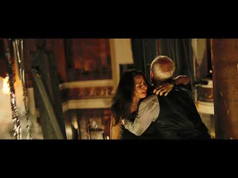 Trailer still — survivors inch through an inverted service tunnel as tense strings and percussion drive the scene