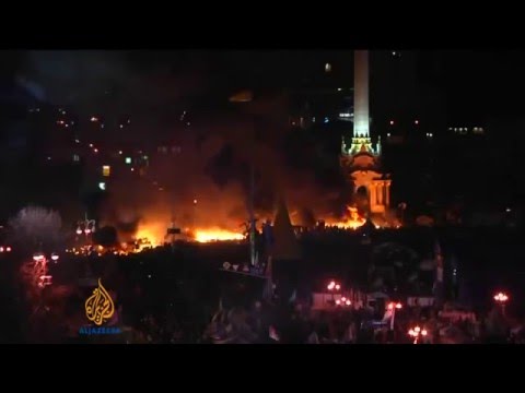 Euromaidan - Ukrainian protest camp is on fire while riot police attack in Kiev Ukraine