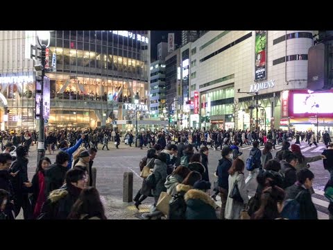 Crossing the famous Shibuya Crossing in Tokyo, Japan