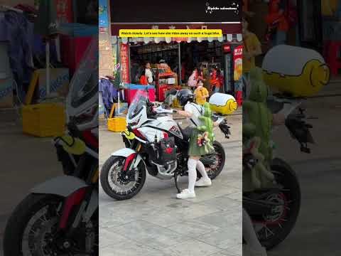 Ice Cream in Her Mouth and a Giant Bike Back on Its Wheels #girlrider #motorcycle #adventurebike