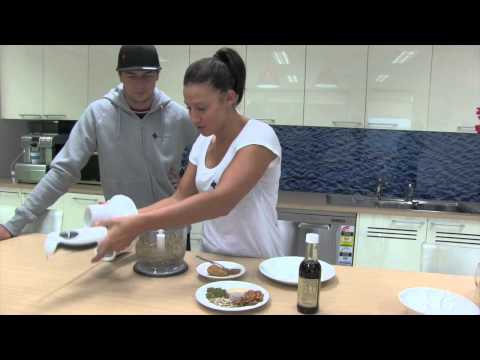 Chaz Mostert and Madi Robinson make protein balls in the Navy Health kitchen.