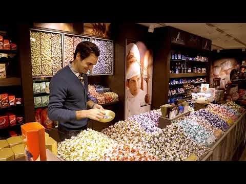 Roger Federer is visiting the new Lindt Shop in his hometown Basel during a break