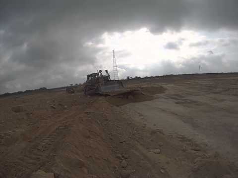 D8R pushing large blade-sized slab of rock