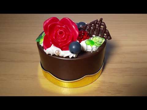 Miniature chocolate rose cake with whipped cream and fruits pastry re-ment .