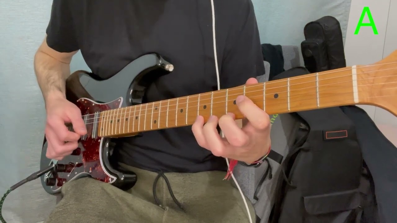Guitarist playing a seconds interval voice-leading exercise on the fretboard